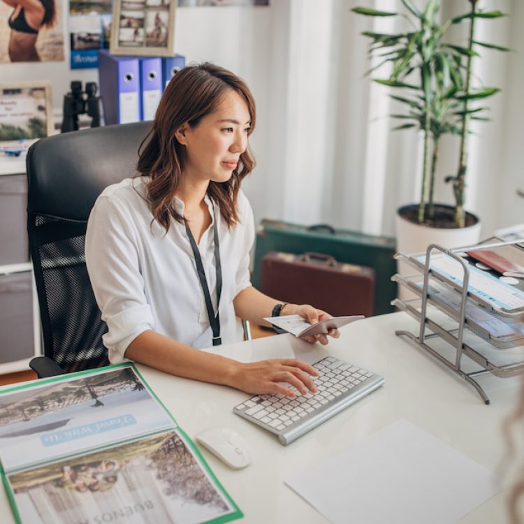 Travel agent making a booking for her client